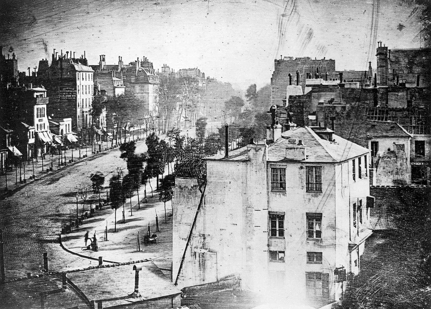 Dramatic early daguerreotype photo from 1837 showing a Parisian street.